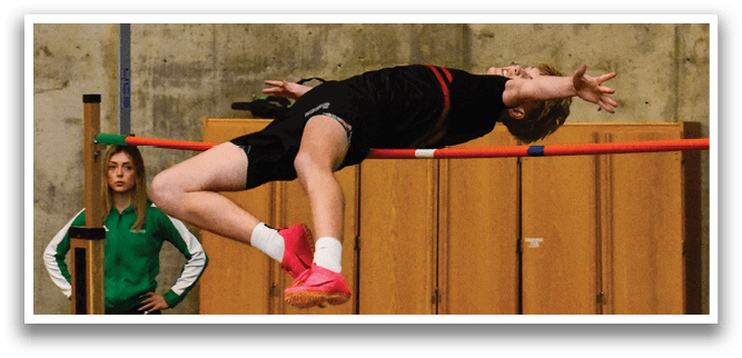 A woman is jumping in the air over a bar, wearing a black shirt and white shoes. AI generated content