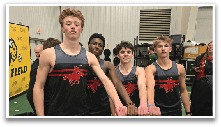 Four men wearing black and red shirts. Description generated by AI
