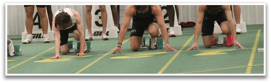 A group of athletes are lined up on a track. Description generated by AI