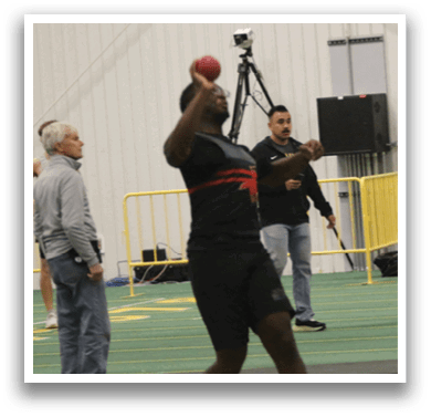 A man is throwing a ball in a field. Description generated by AI