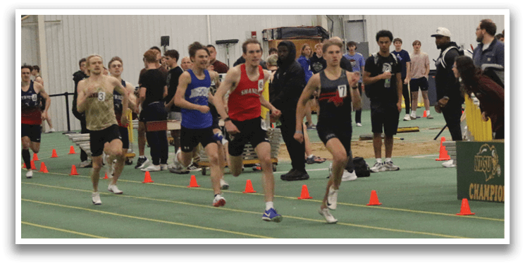A group of people are running on a track. Description generated by AI