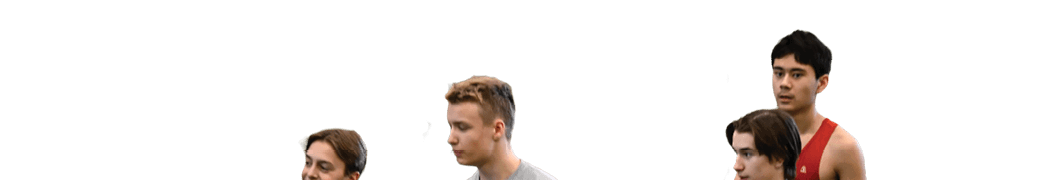 Three boys walking on a field. Description generated by AI