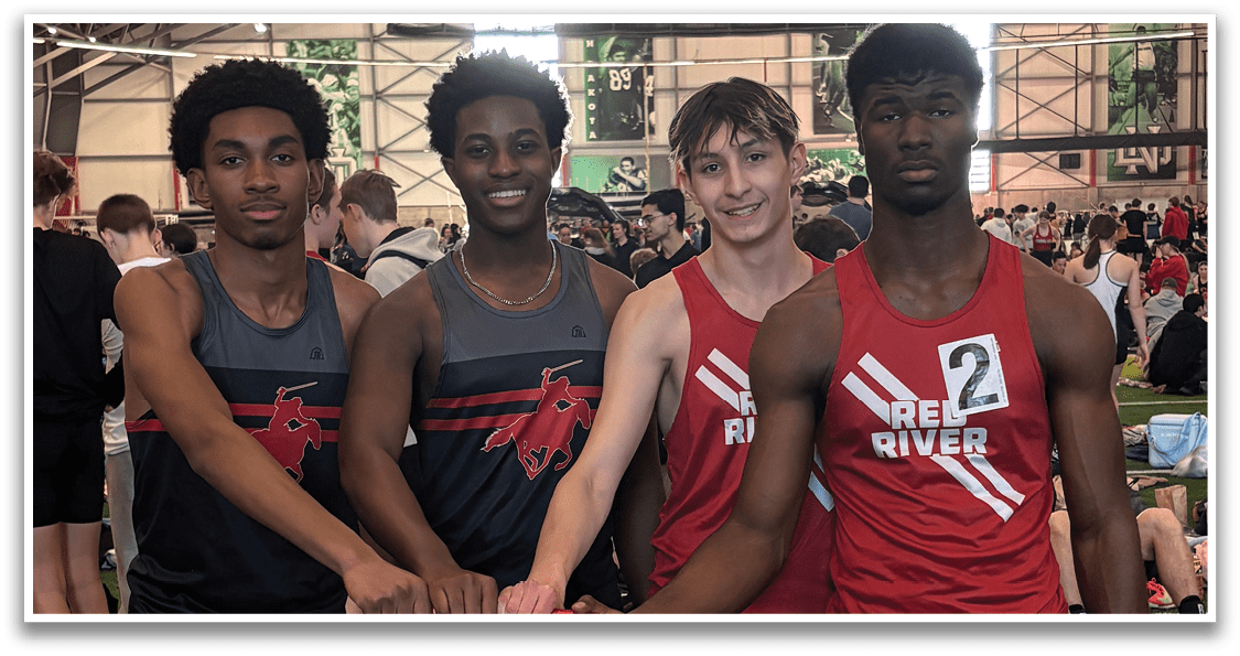 Four young men wearing red and black shirts and shorts pose for a picture. Description generated by AI