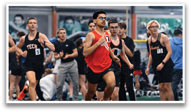 A group of people running on a track. Description generated by AI
