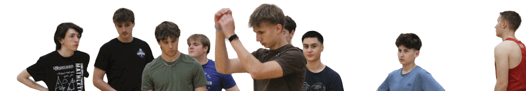 A group of people are standing in a gym. Description generated by AI