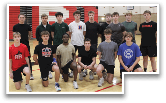 A group of young men and women in a gym. Description generated by AI