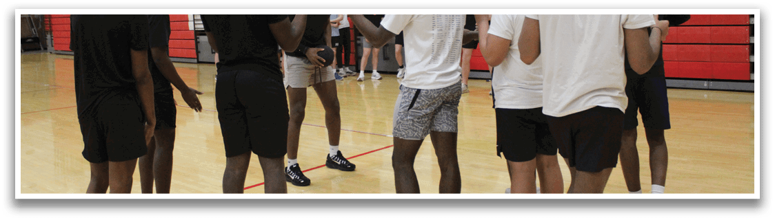 A group of young men in a gym. Description generated by AI