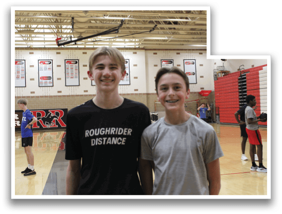 Two boys wearing black shirts with white letters. Description generated by AI