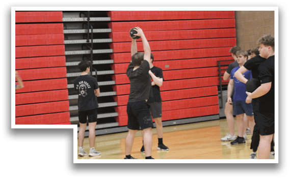 A group of people are playing a game in a gym. Description generated by AI