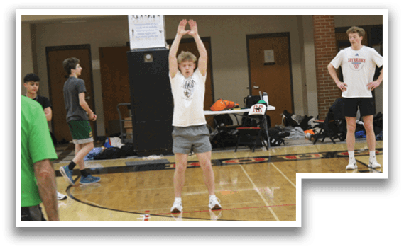 A group of people playing basketball. Description generated by AI