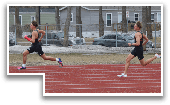 A man running on a track. Description generated by AI