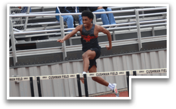 A man is jumping over a hurdle on a track. Description generated by AI