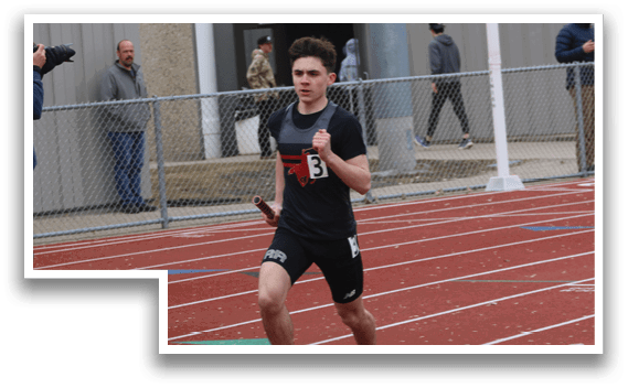 A man running on a track. Description generated by AI