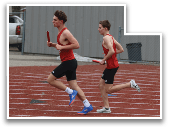 Two men running on a track. Description generated by AI
