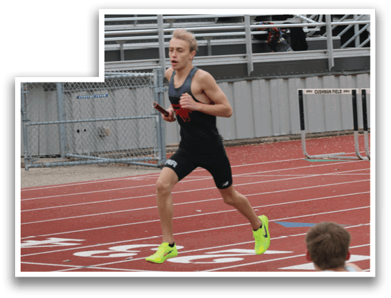 A man running on a track with a red and white shirt. Description generated by AI