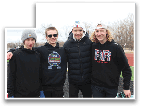 Four young men wearing black hoodies and sunglasses pose for a picture. Description generated by AI