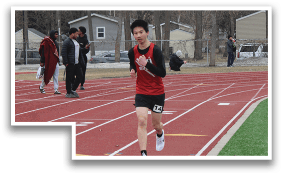 A man running on a track. Description generated by AI