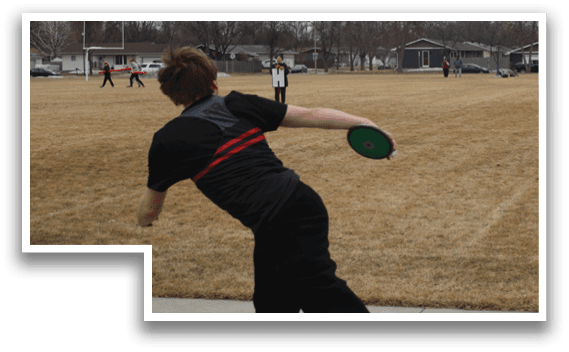 A man is throwing a frisbee in a field. Description generated by AI
