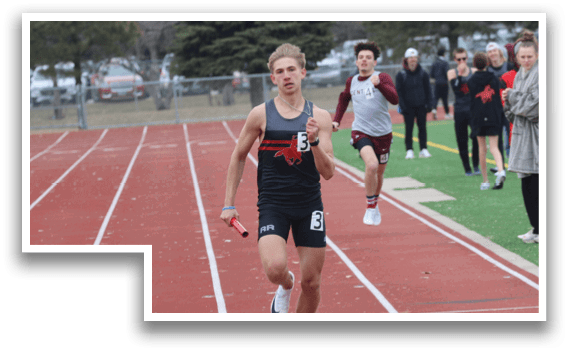 A man running on a track with a crowd of people watching. Description generated by AI