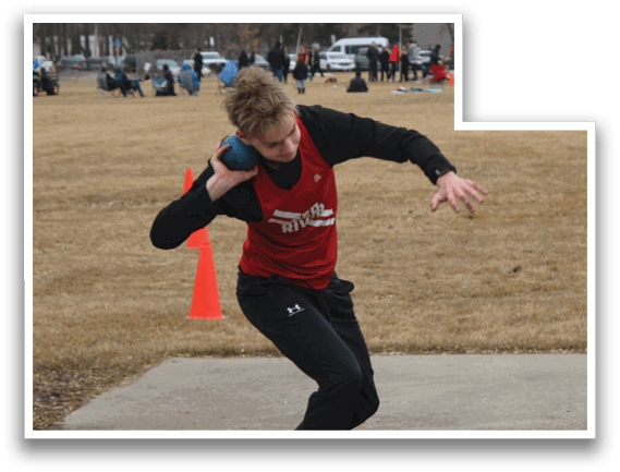 A man in a red shirt and black pants is throwing a frisbee. Description generated by AI