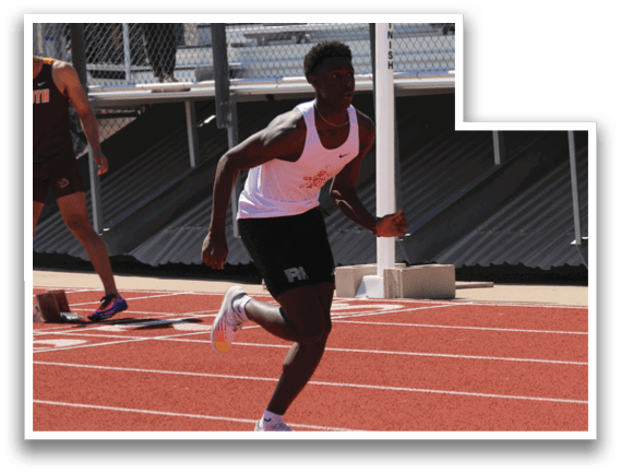 A man running on a track. Description generated by AI