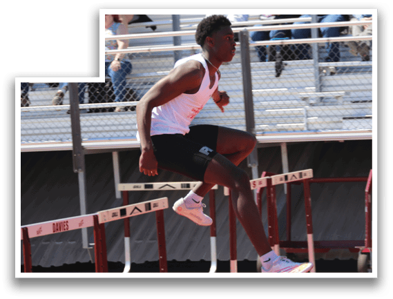 A man is jumping over a hurdle. Description generated by AI