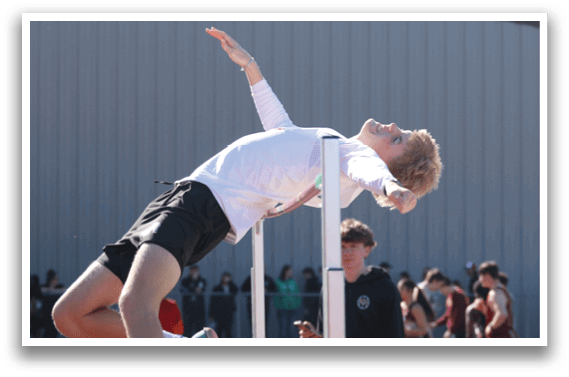 A man is jumping over a pole. Description generated by AI