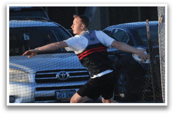 A man is throwing a frisbee in a field. Description generated by AI