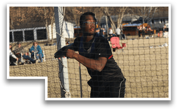 A man in a black shirt and black pants is throwing a baseball. Description generated by AI