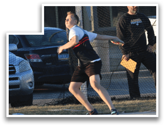 A man is throwing a frisbee in a parking lot. Description generated by AI