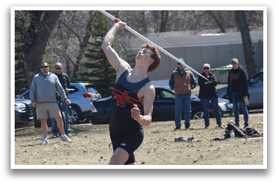 A man is jumping in the air to catch a pole. Description generated by AI