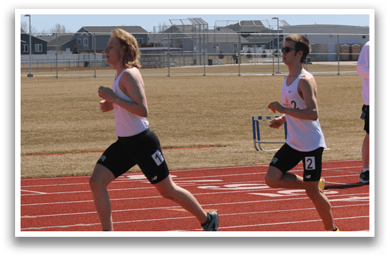 A man running on a track. Description generated by AI