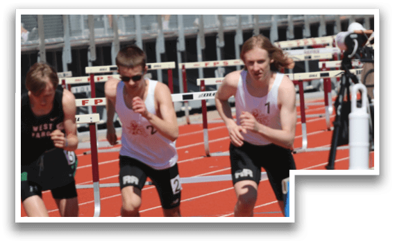 A group of young men running on a track. Description generated by AI