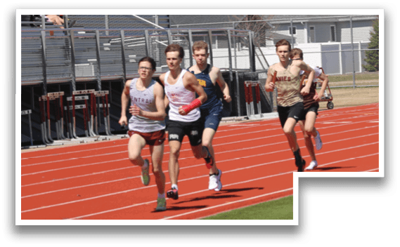 A group of people running on a track. Description generated by AI