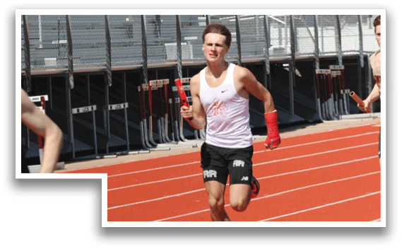 A group of men running on a track. Description generated by AI