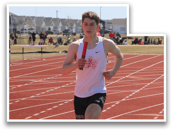 A man running on a track with a red and white shirt. Description generated by AI