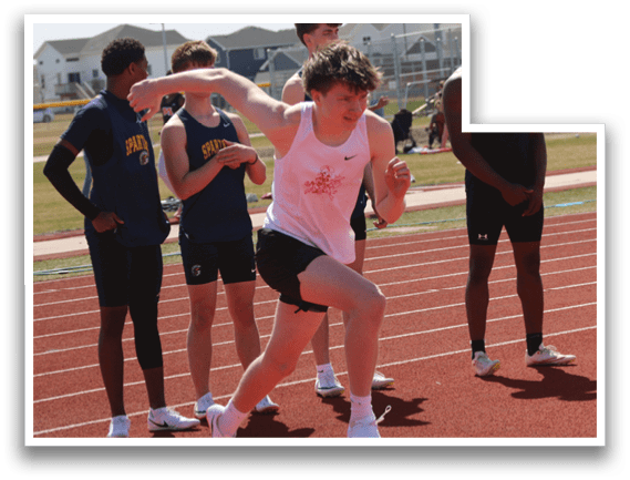 A group of people running on a track. Description generated by AI