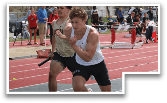 A man running on a track with a red and white shirt. Description generated by AI