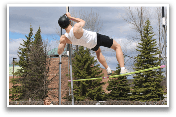 A man is doing a trick on a pole. Description generated by AI