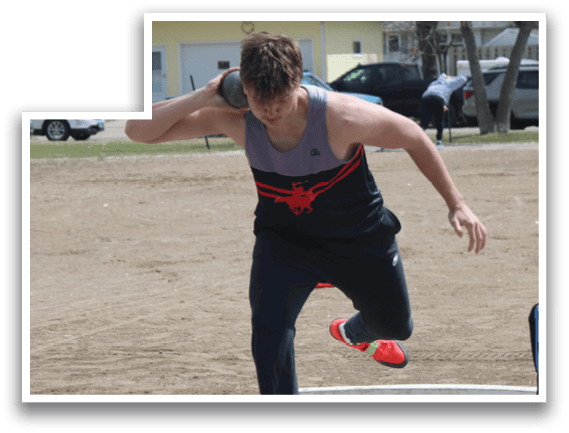 A man wearing a red shirt and black pants is throwing a frisbee. Description generated by AI