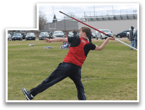 A boy in a red shirt is throwing a red object. Description generated by AI