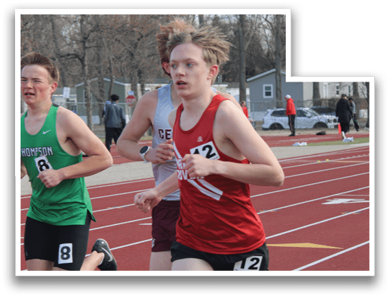 A boy running on a track with the number 12 on his shorts. Description generated by AI