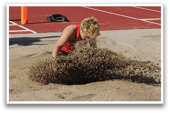 A person is digging in the sand. Description generated by AI