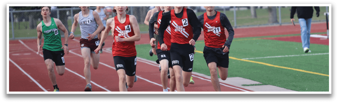 A group of people running on a track. Description generated by AI