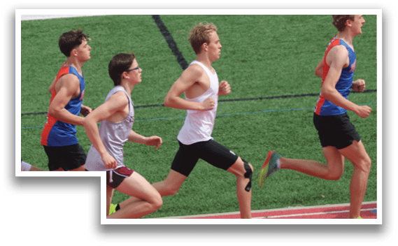 A group of young men running on a track. Description generated by AI