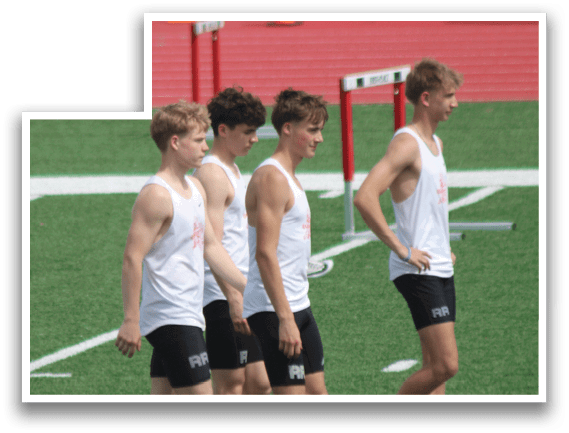 A group of young men walking on a field. Description generated by AI