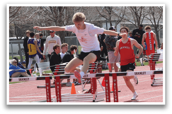A man is jumping over a hurdle. Description generated by AI