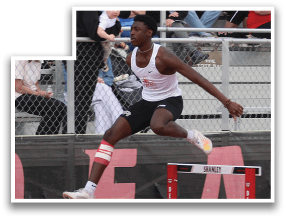 A man is jumping over a hurdle on a track. Description generated by AI