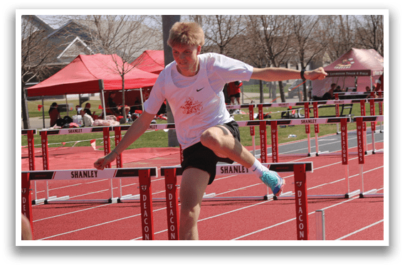 A man is jumping over a hurdle. Description generated by AI
