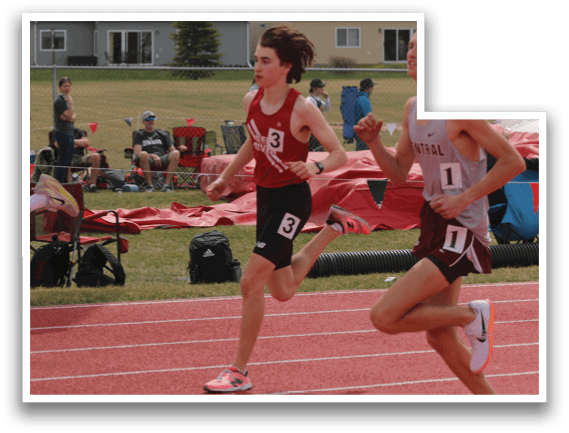 A man running on a track. Description generated by AI